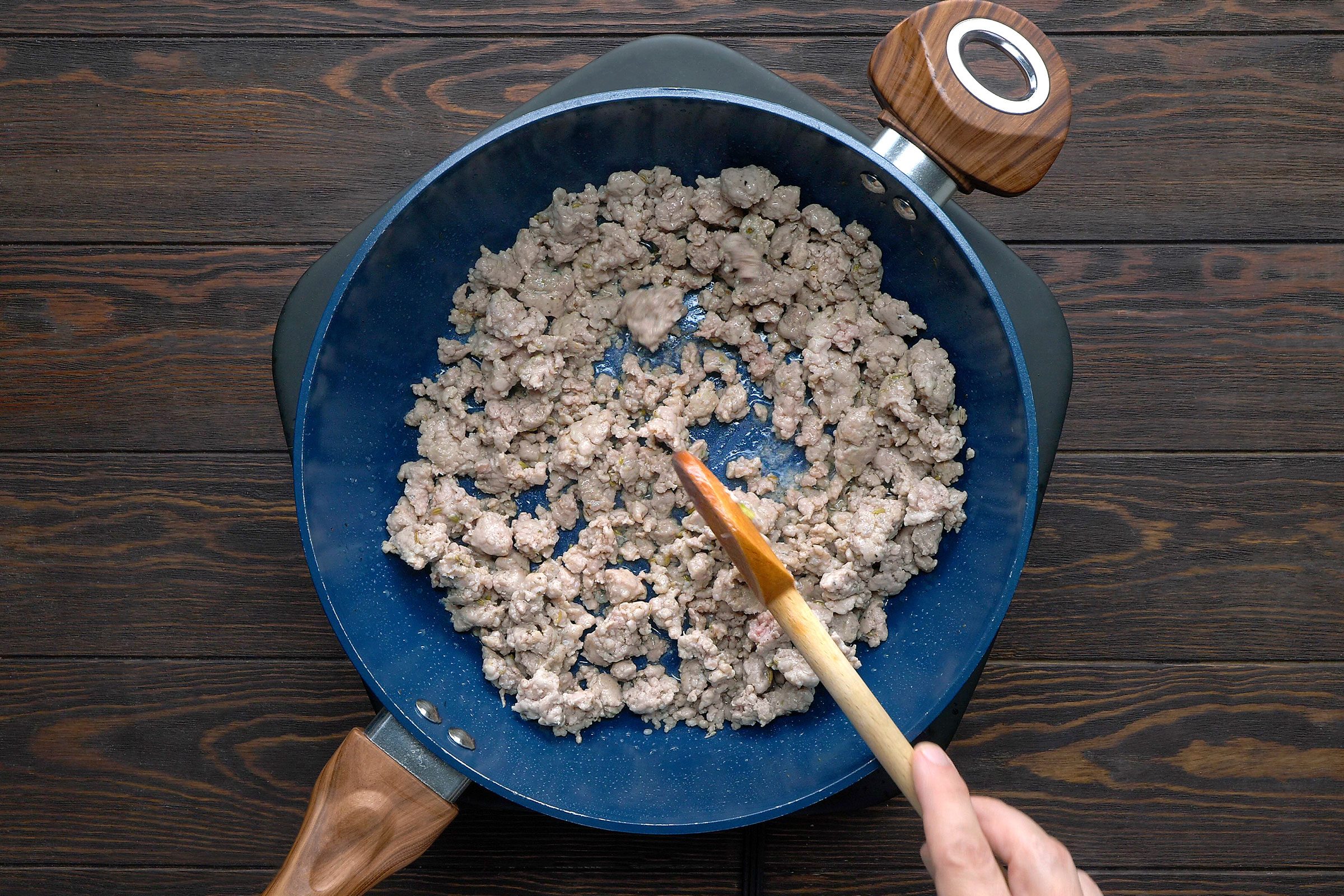 Cook the sausage over medium heat until it's no longer pink