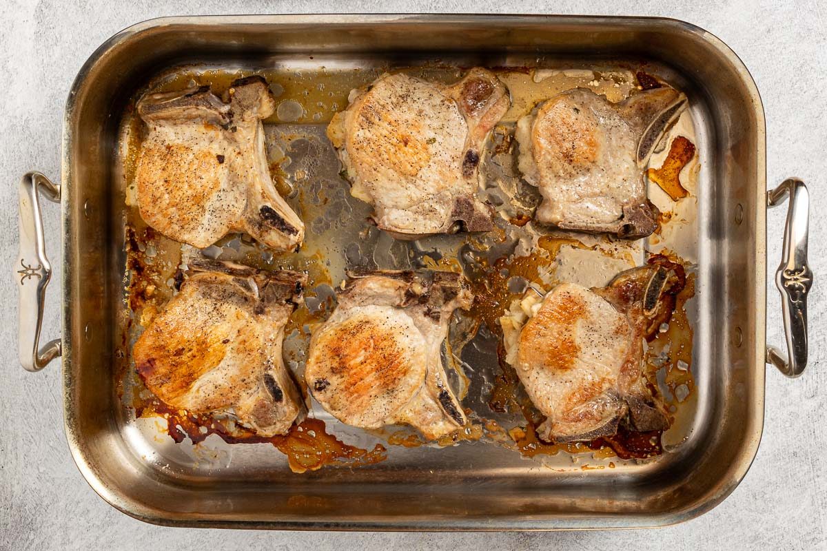 pork chops on a baking sheet