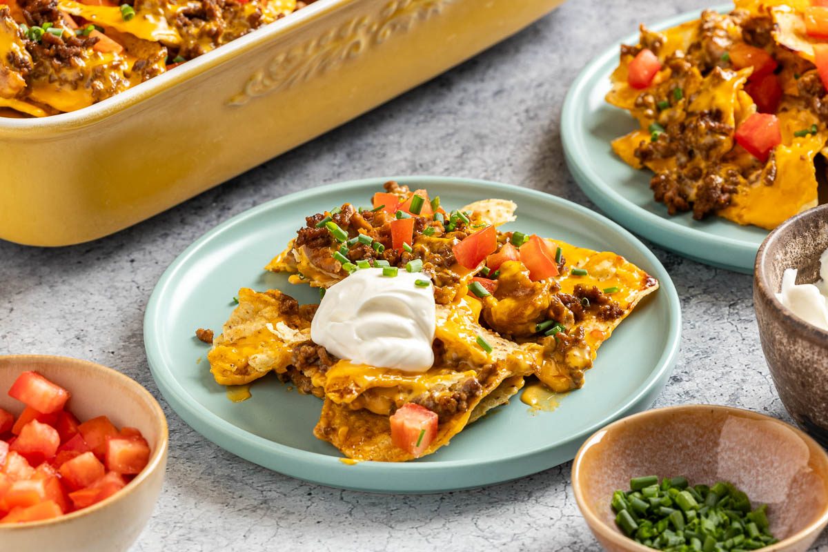 Taste of Home Baked Nachos photo of the finished recipe served on plates.