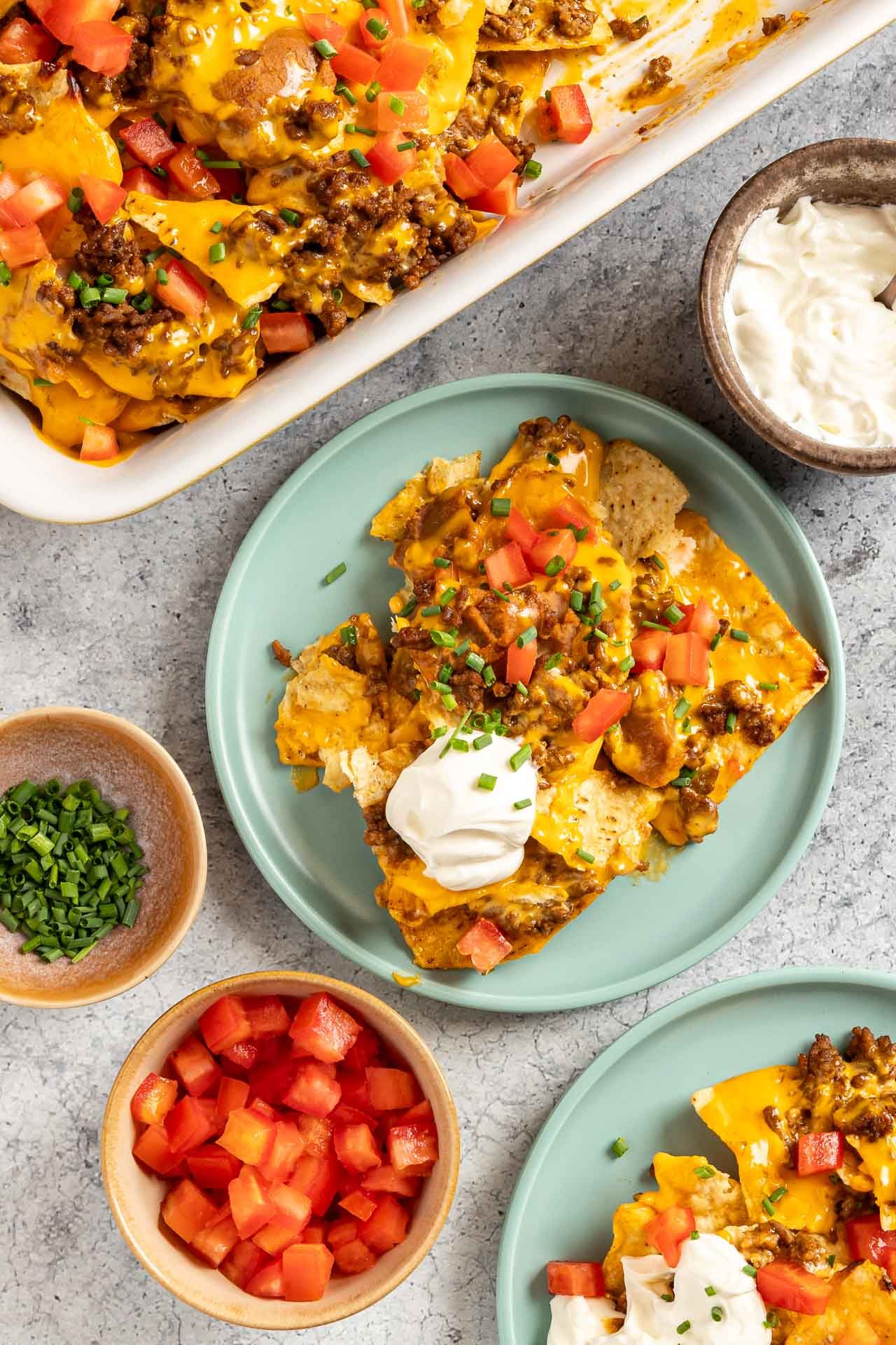 Taste of Home Baked Nachos photo of the finished recipe served on plates.