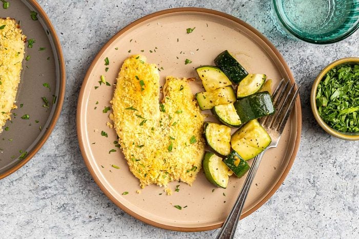 Taste of Home Baked Tilapia with Panko Bread Crumbs photo of the finished recipe served on plates.