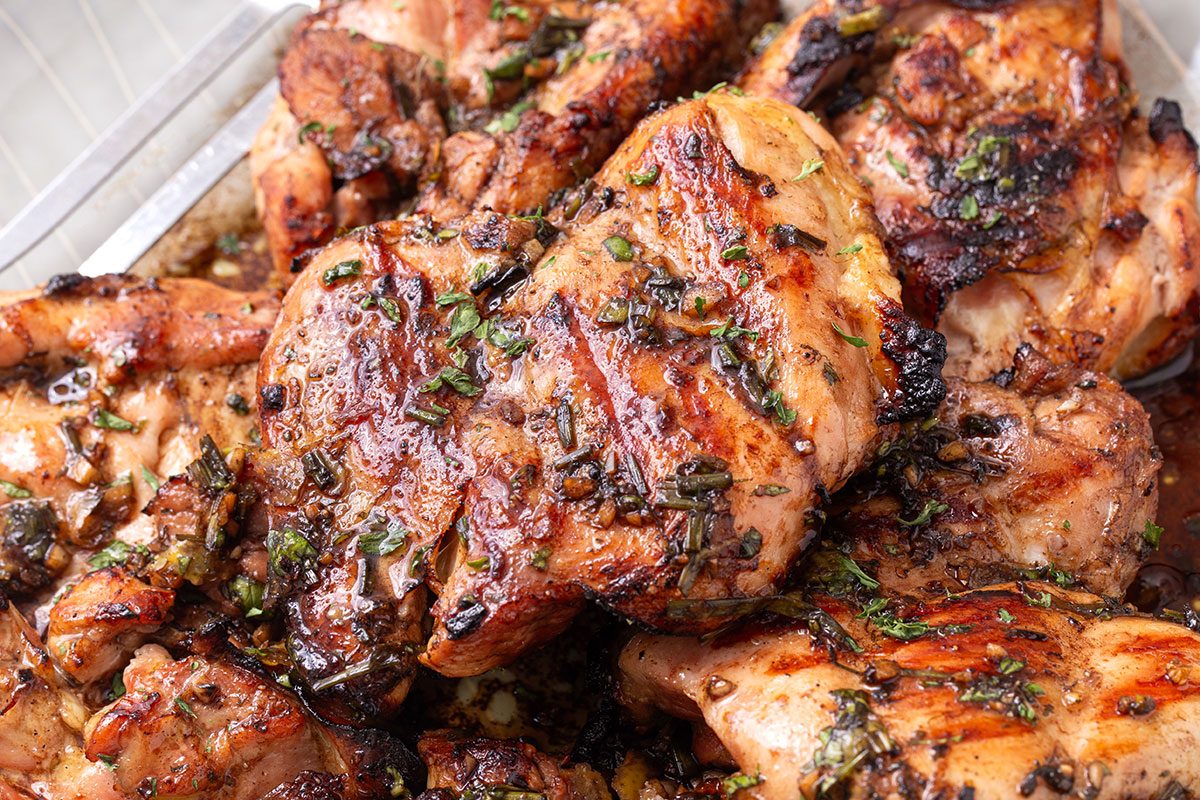 Balsamic Chicken on a serving platter topped with chopped parsley or Taste of Home
