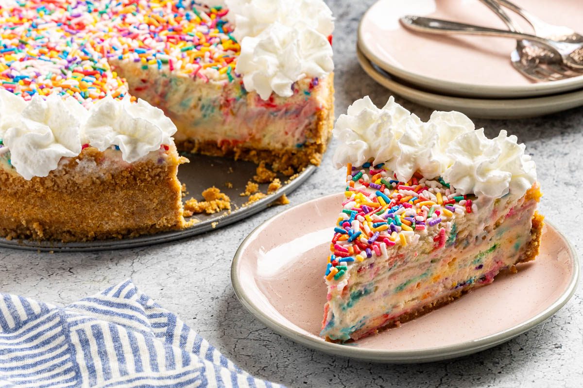 Taste of Home Birthday Cheesecake photo of the finished recipe cut into slices and served on plates.