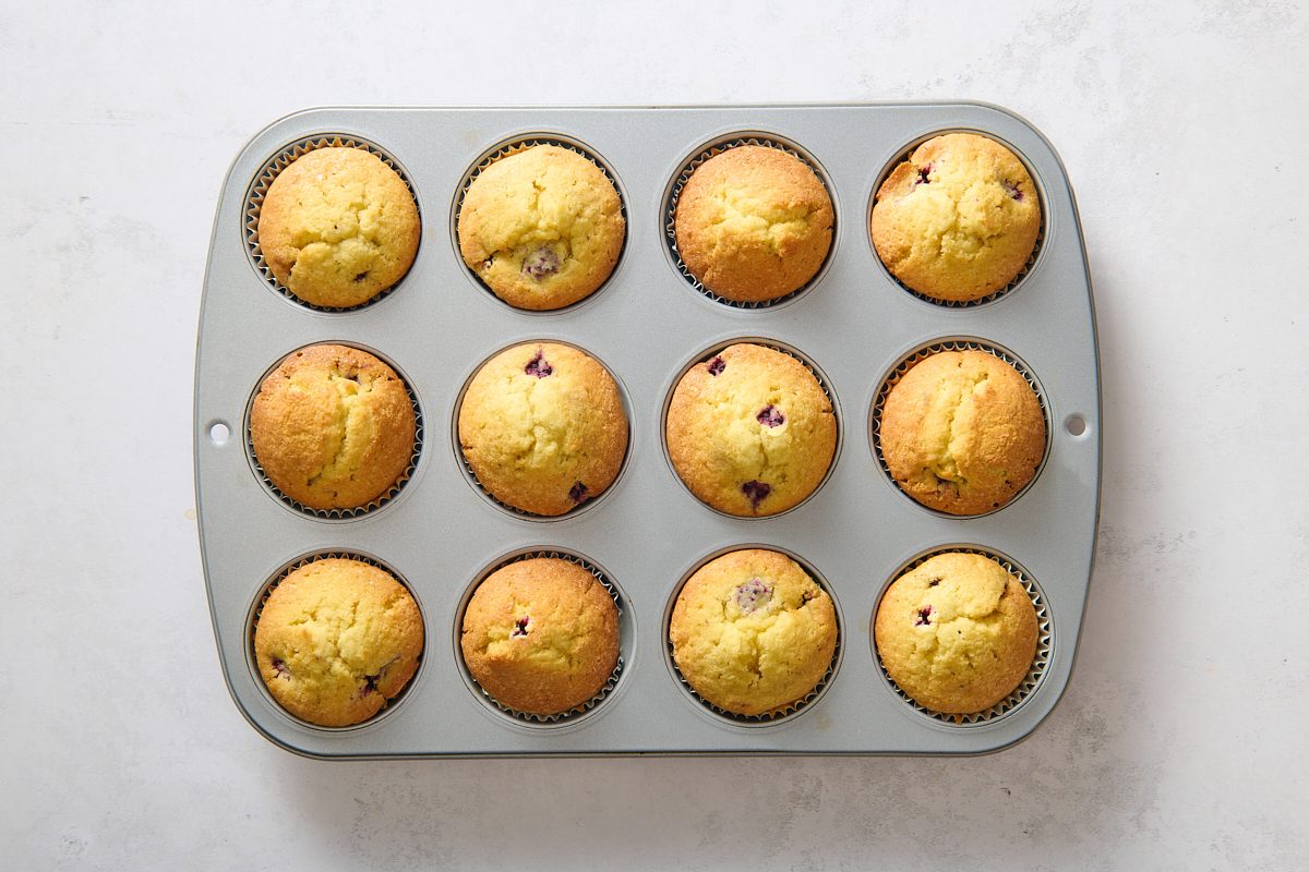 Blackberry muffins after being baked in a muffin tin
