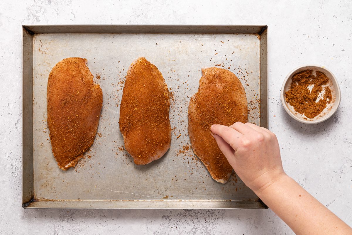 Pan With Chicken Breasts Covered In Spices
