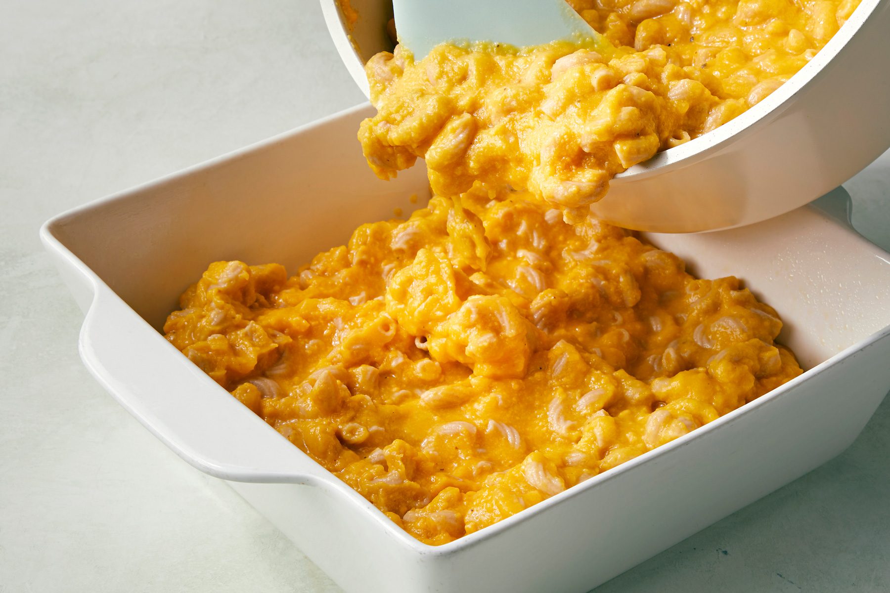 Transfer to a greased 8 inch square baking dish; Sprinkle with bread crumbs
