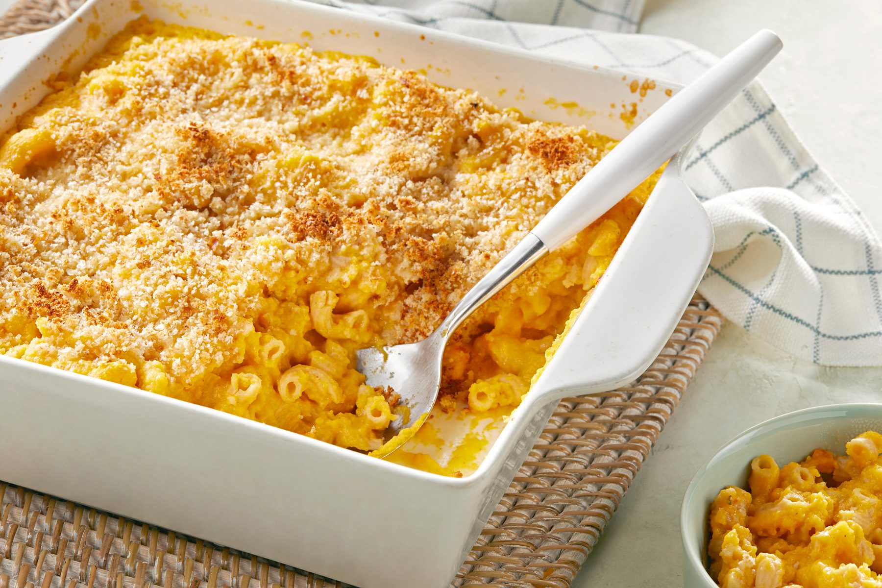 3/4th shot of butternut squash mac and cheese in a baking dish
