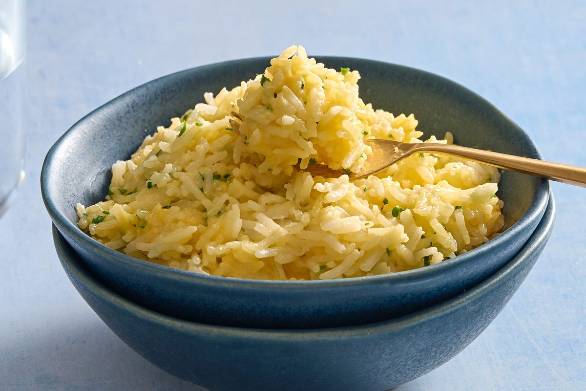 Closeup shot of a bowl of cheesy rice