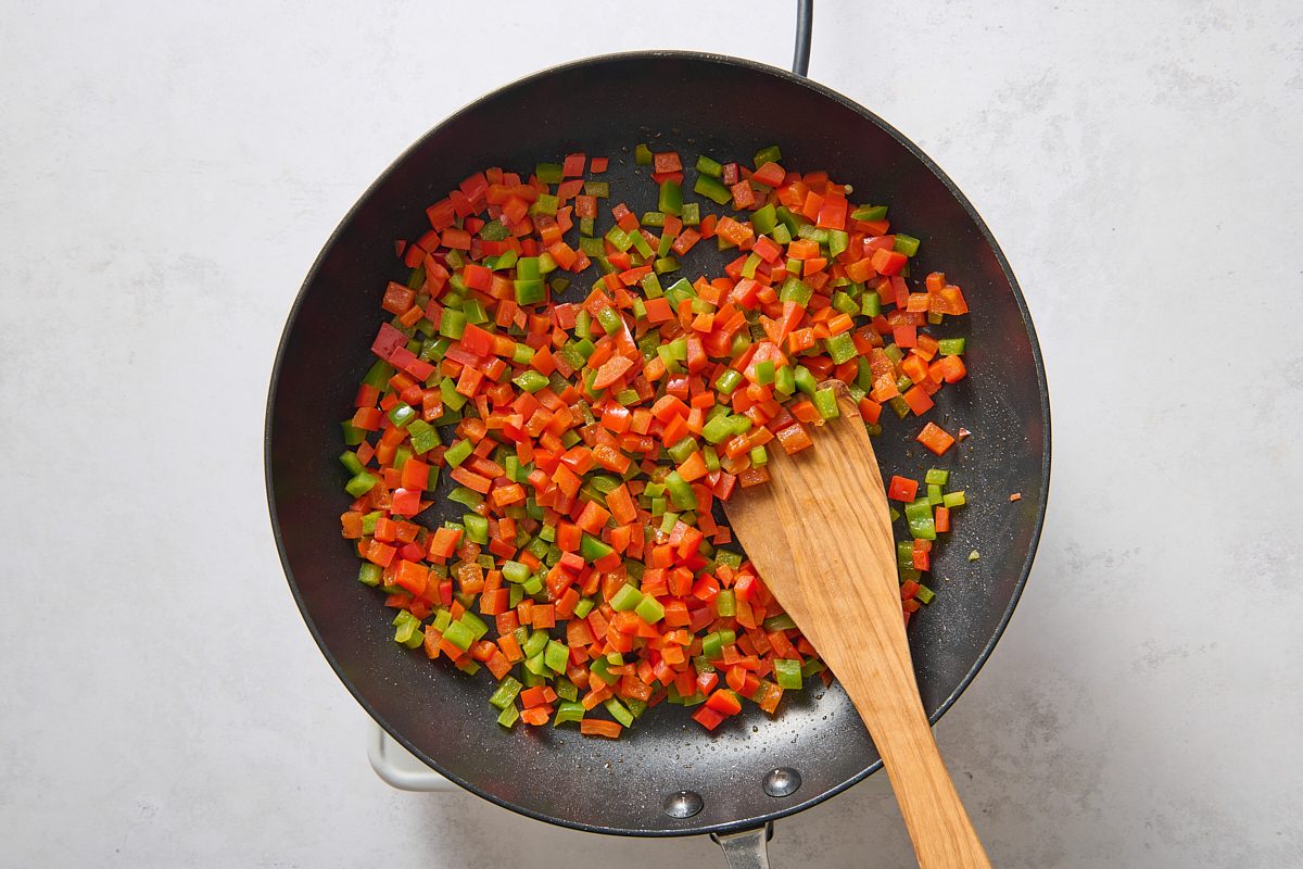 Sautéing the peppers in a skillet