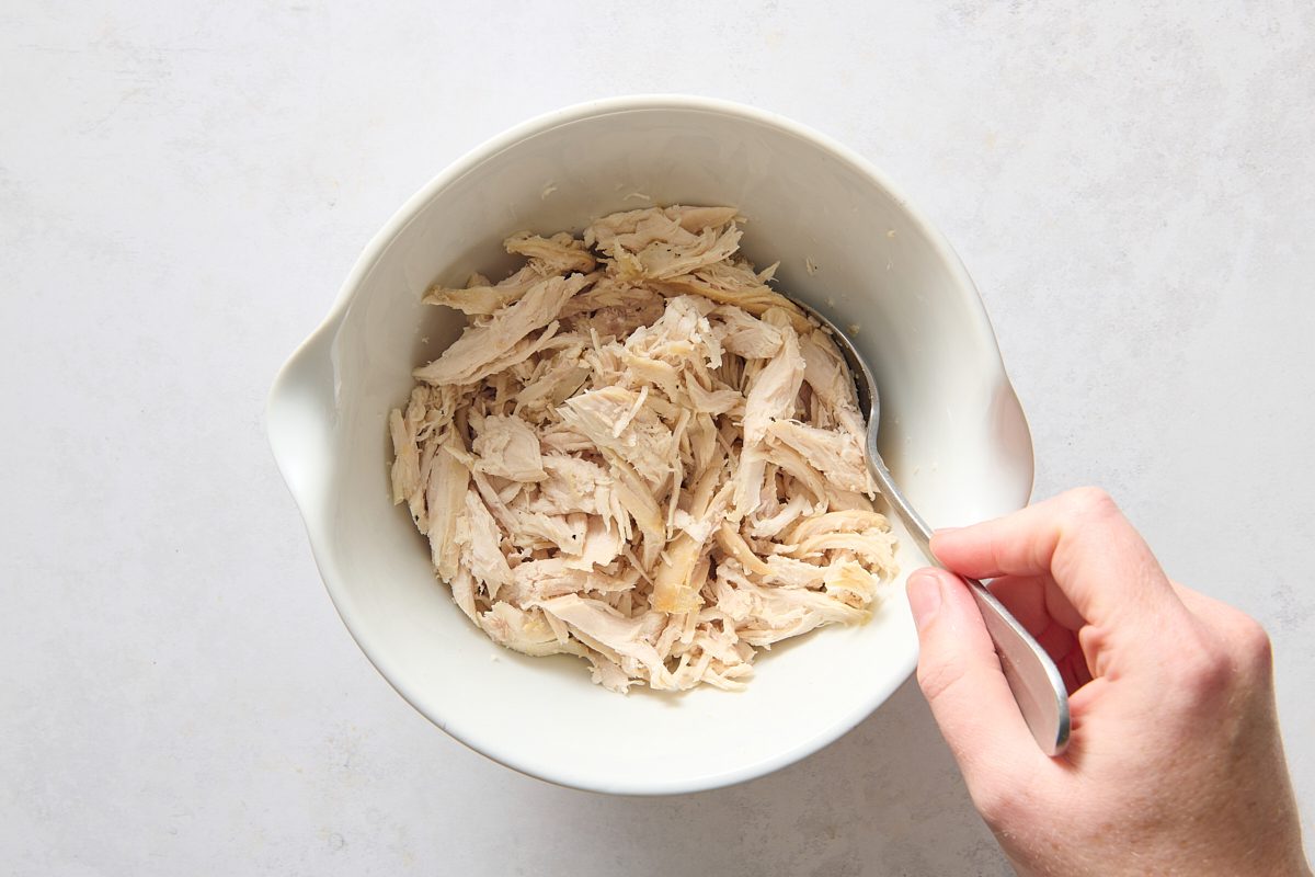 Combining the chicken with lime juice and seasoning