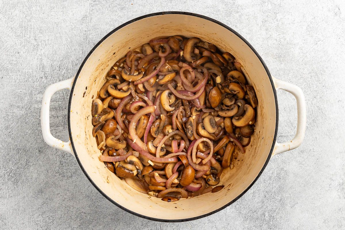 vegetables cooking in a Dutch oven.