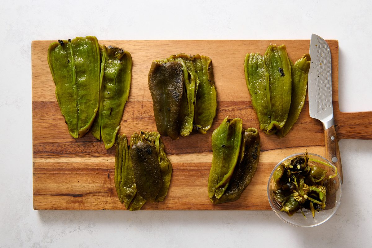 Preparing the charred poblano peppers