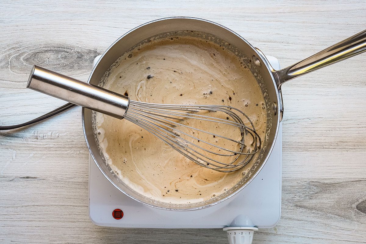 Combining coffee ice cream ingredients in a saucepan for a recipe from Taste of Home.