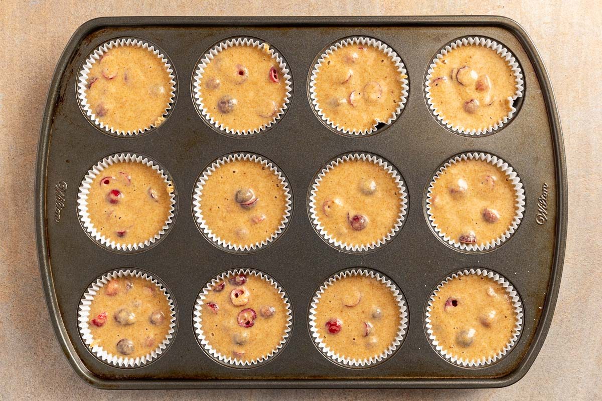 Cranberry Orange Muffins in muffin pan