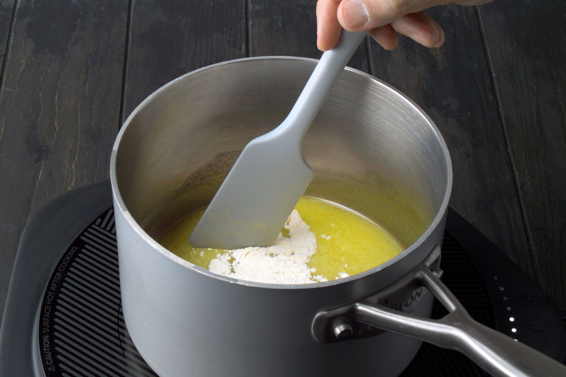 Flour being stirred into melted butter