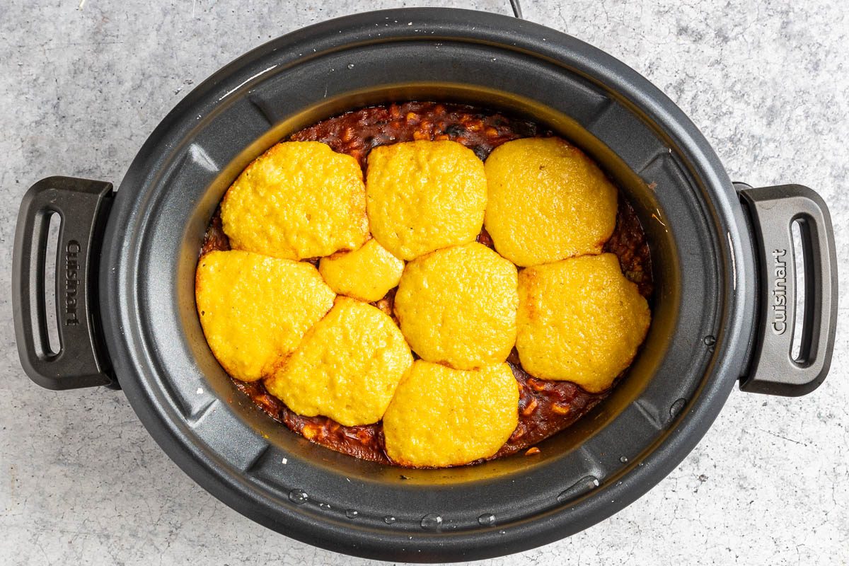 Taste of Home Crockpot Tamale Pie photo of adding the cornbread topping.