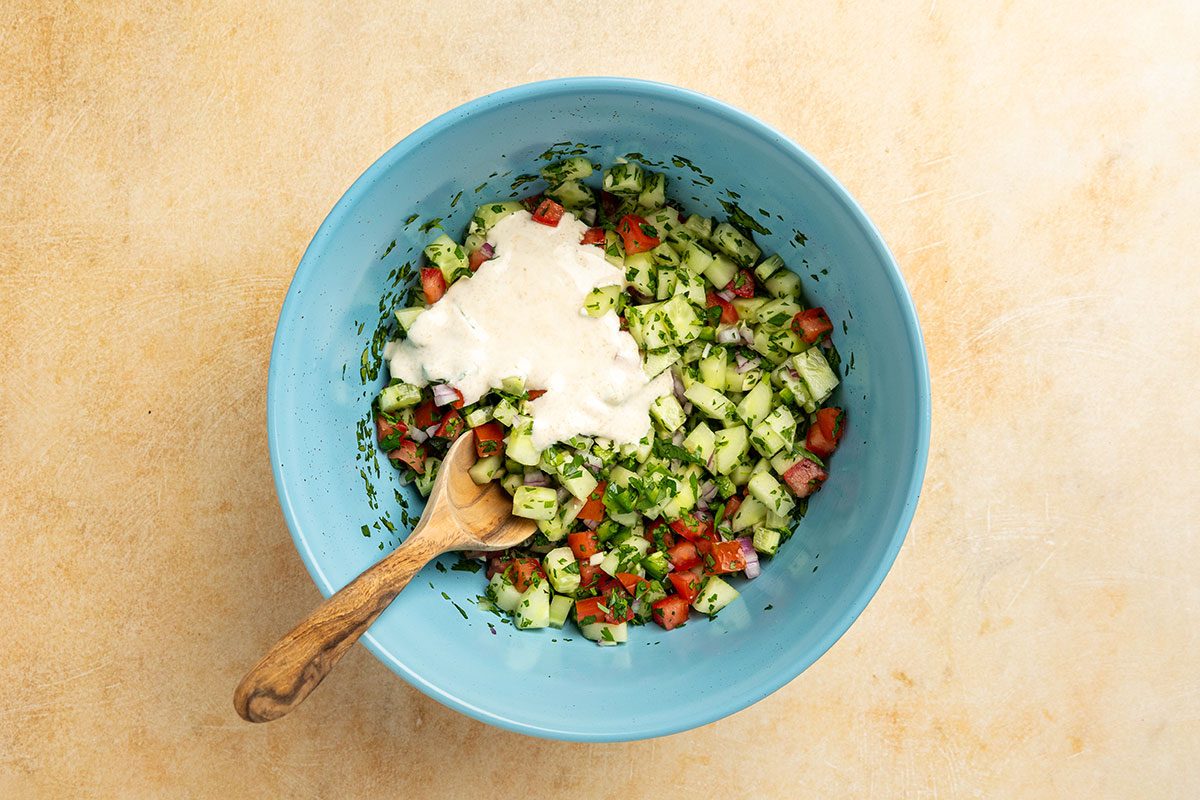 creamy dressing poured over the cucumber mixture.
