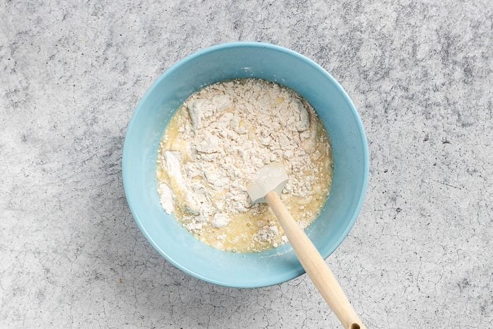 mixing the wet and dry ingredients until moistened.