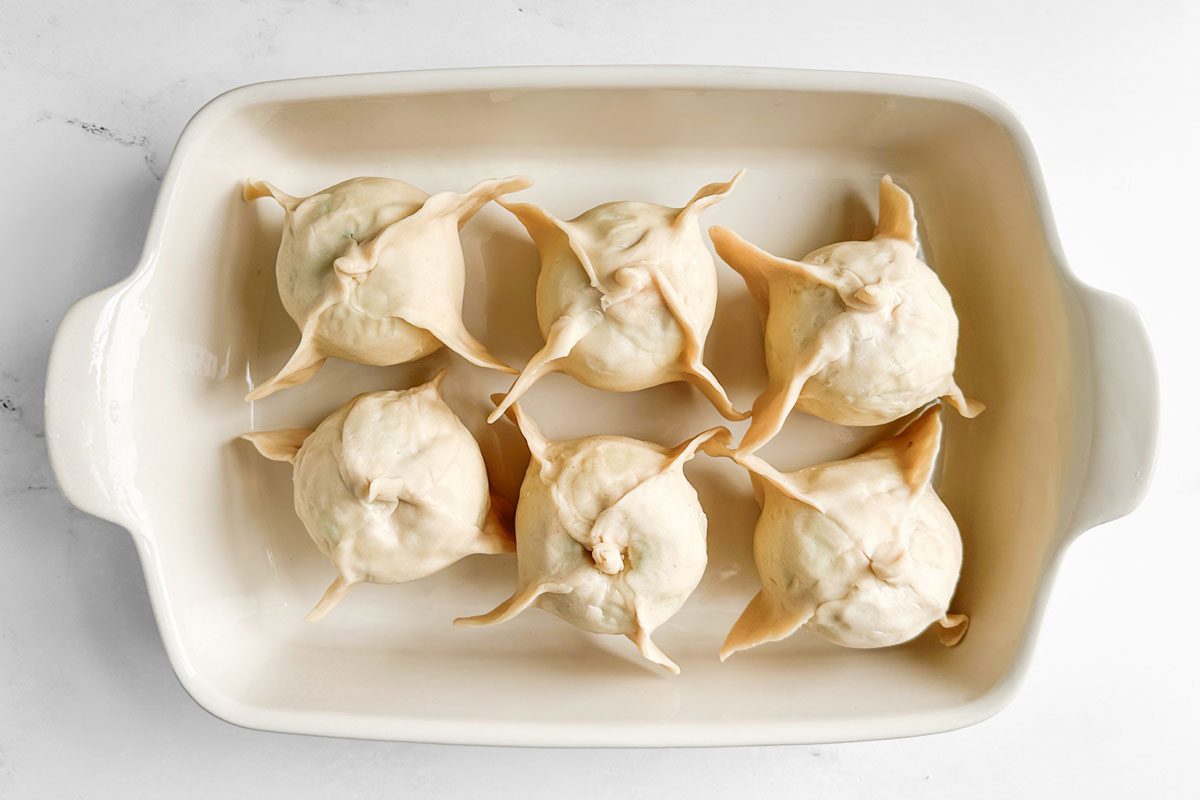 Unbaked Taste Of Home Easy Apple Dumplings In A White Baking Pan