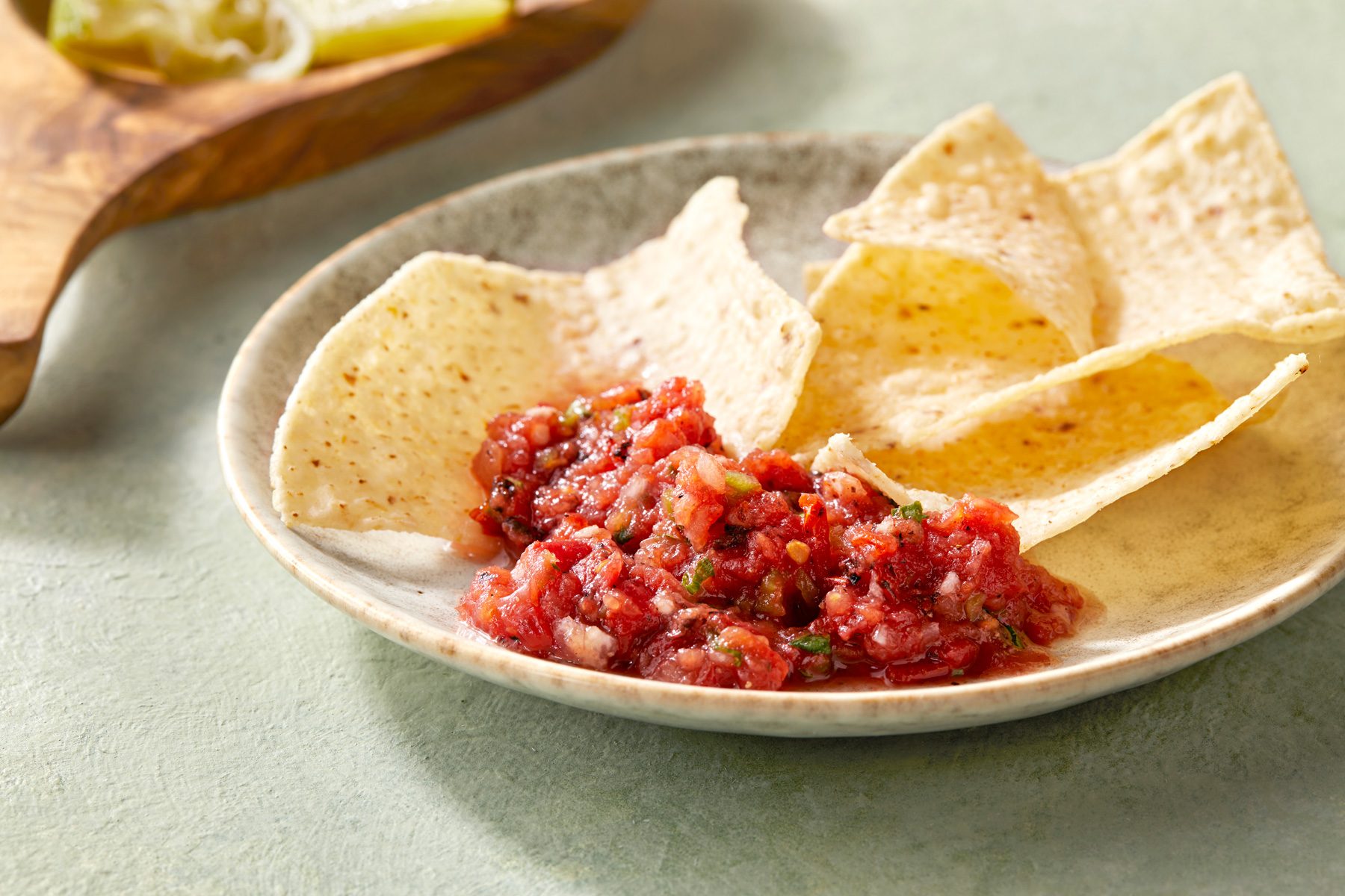 3/4th shot of salsa with nachos