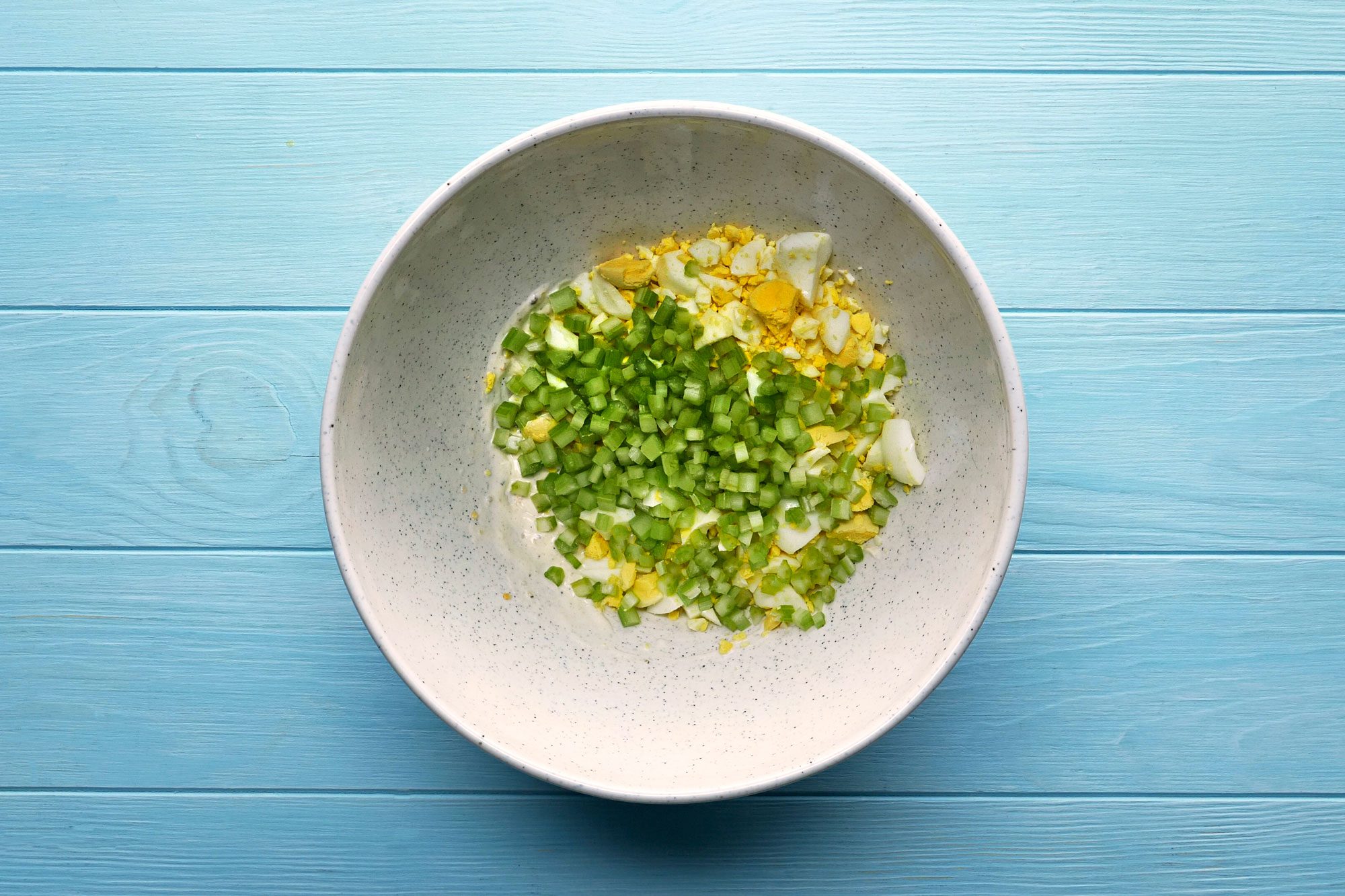 In a large bowl, combine mayonnaise, lemon juice, onion, salt and pepper. Stir in eggs and celery.