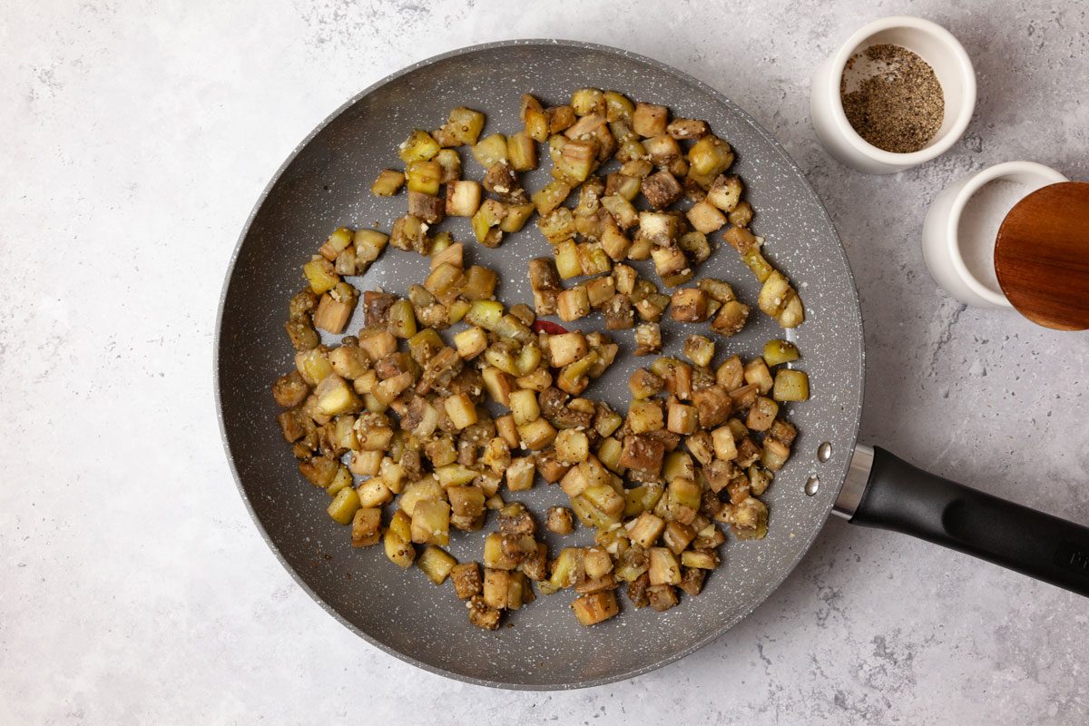 Step 1 of Taste of Home Eggplant Parmesan Meatballs cook the eggplant and the garlic