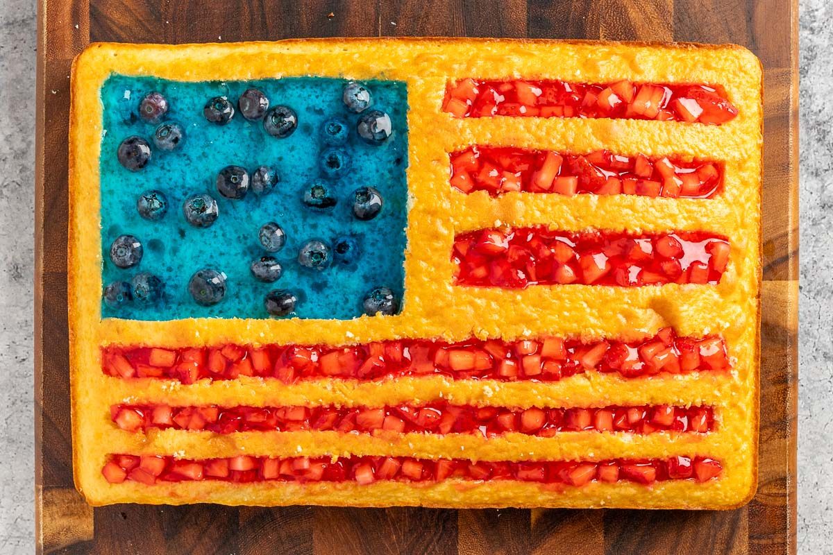 adding the blurberry gelatin to the rectangle and the strawberry gelatin to the stripes.