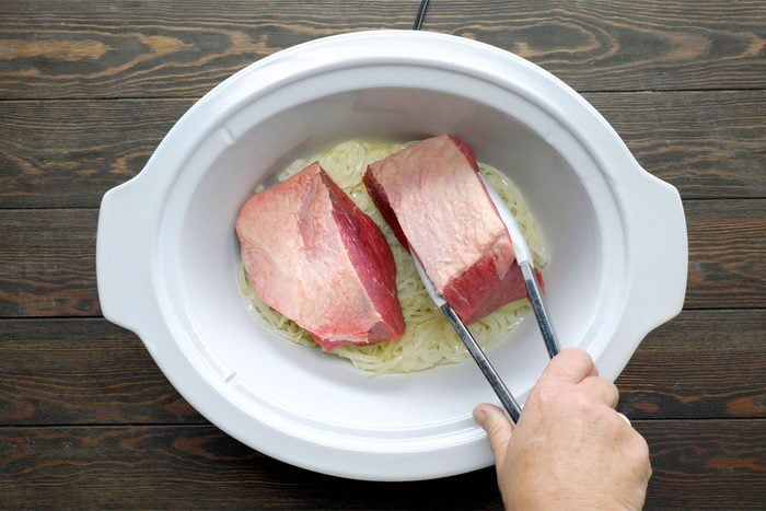 Cut Roast In Half; Place Over Onions.