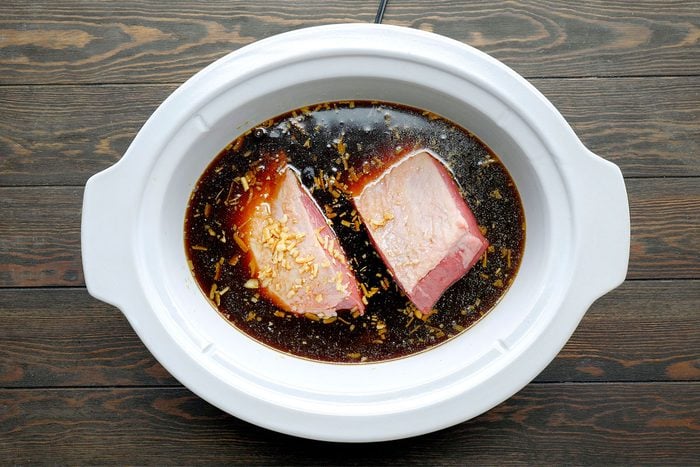 In a large bowl, combine water, soy sauce, soup mix, Cover and cook on low until meat is tender,