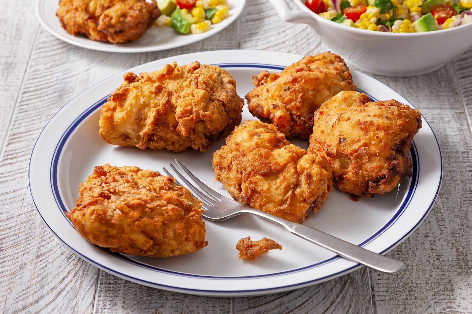 3/4th shot of fried chicken thighs