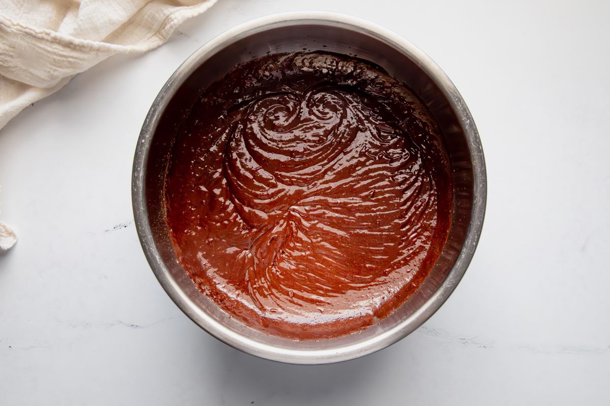 Overhead shot for Taste of Home Fudge Pie, fudge filling in a metal bowl.