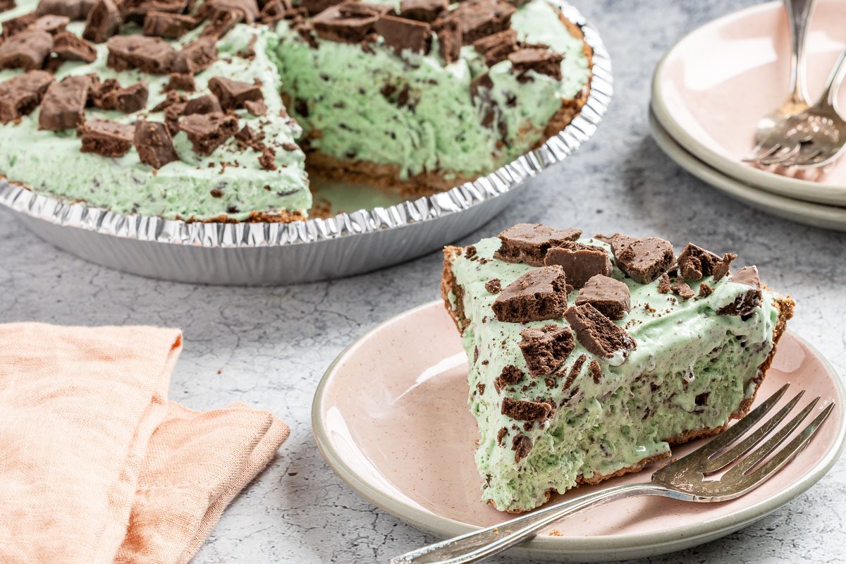 Taste of Home Grasshopper Pie photo of the finished recipe cut into slices and served on a plate.