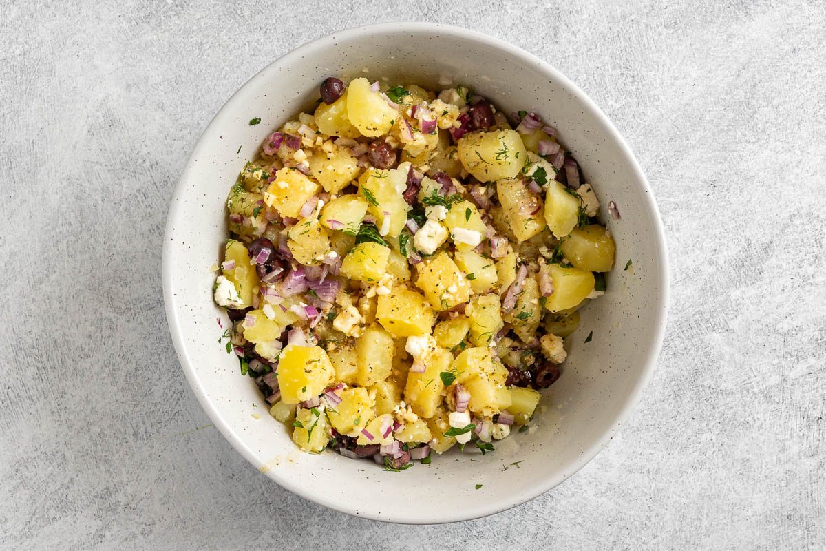 Greek Potato Salad with dressing added