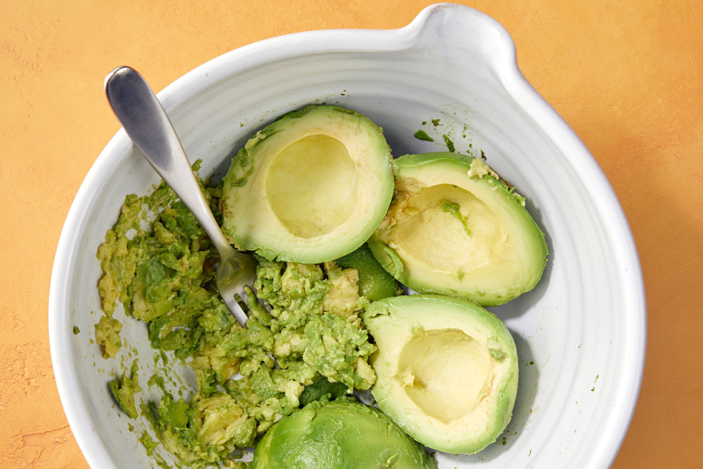 Mashed avocados in a bowl