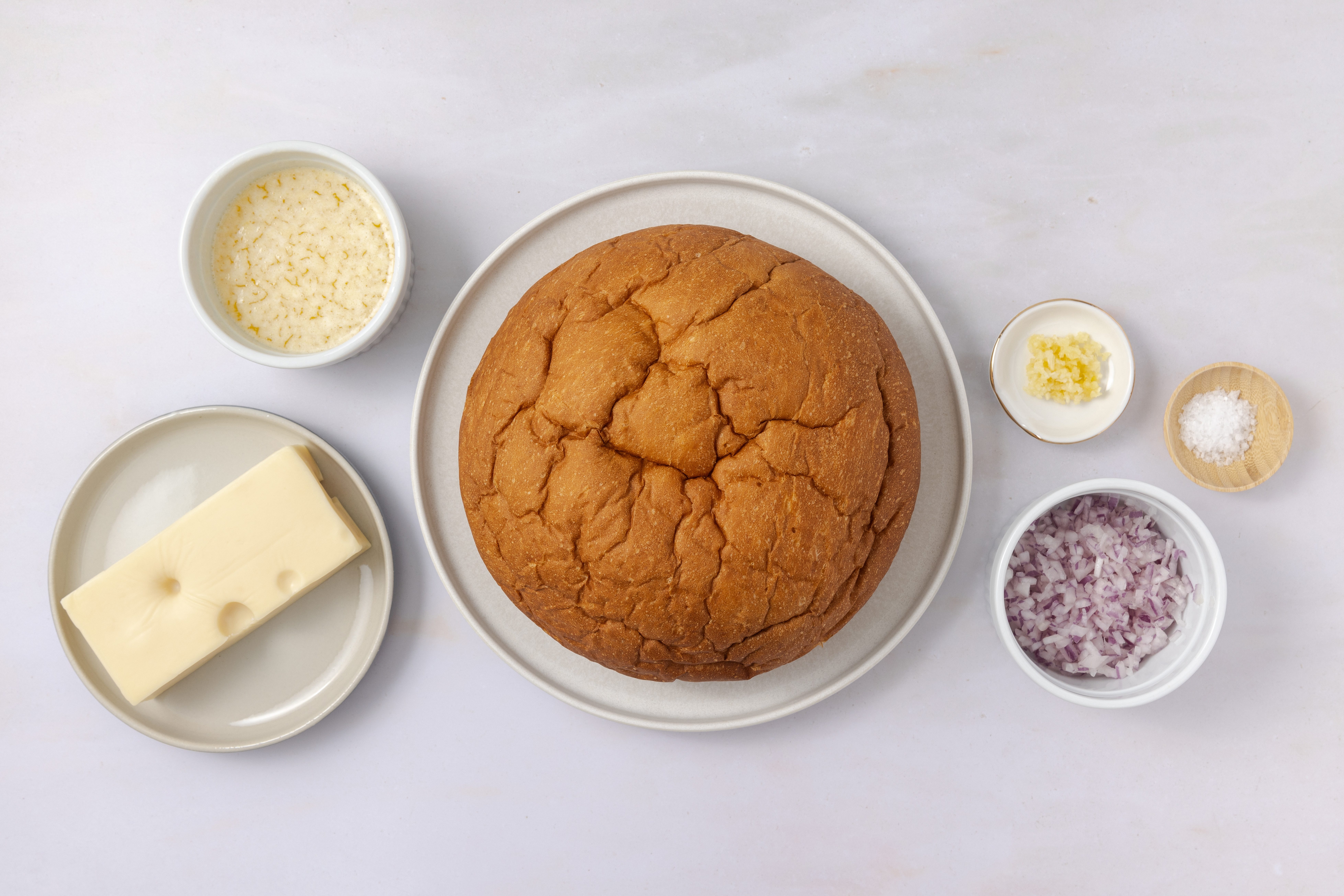 Ingredients for hawaiian cheese bread on kitchen counter.