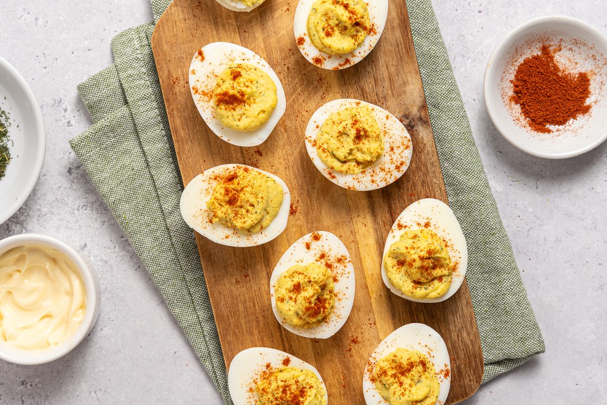 Horseradish Deviled Eggs On Wood Board