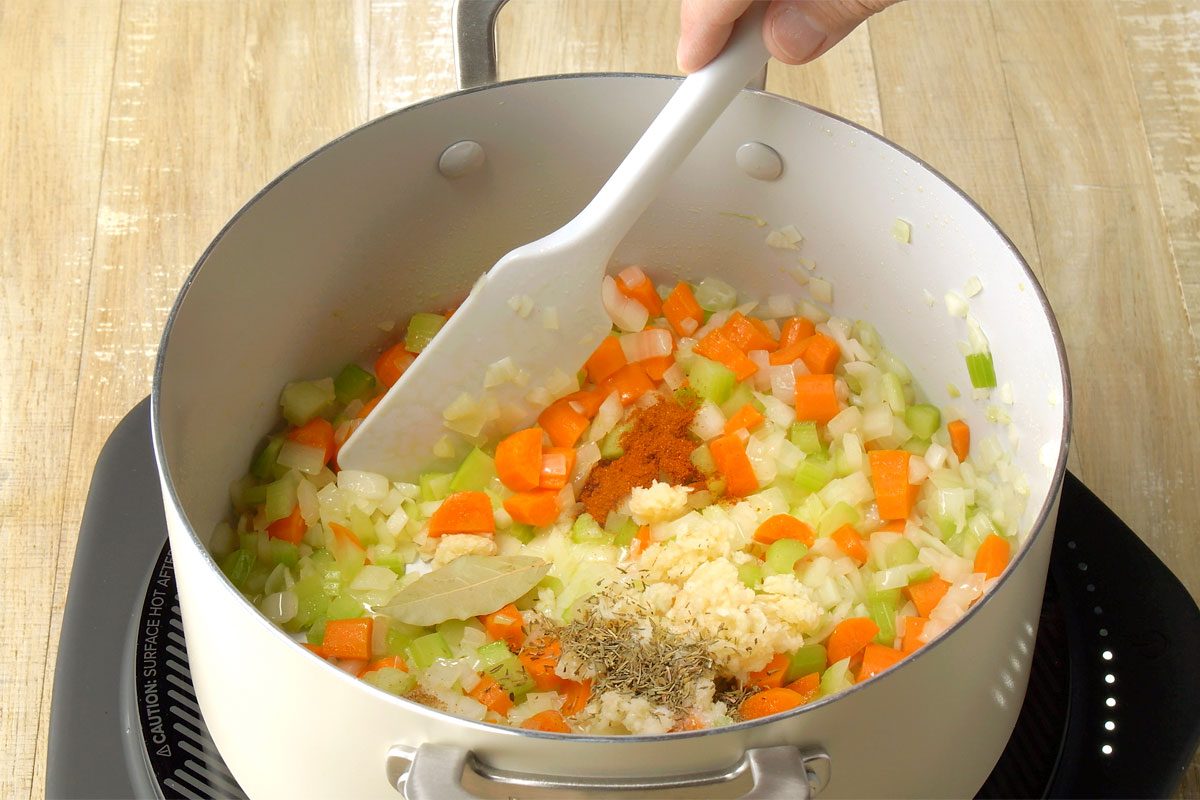 Adding seasonings to the pot