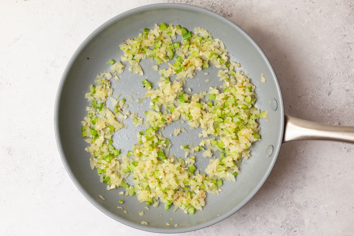 Step 2 of Taste of Home Lentil Meatballs is to cook the veggies in a pan