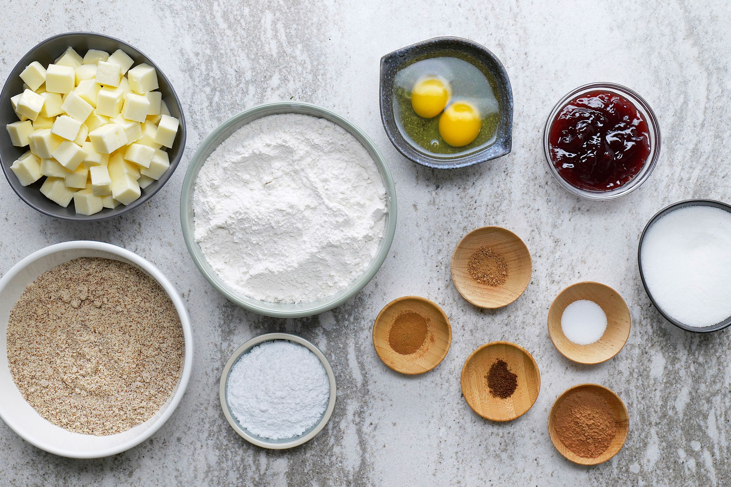 Butter, Sugar, Eggs, Flour, Cocoa powder, Salt, Spices, Almonds, Raspberry jam, confectioners sugar