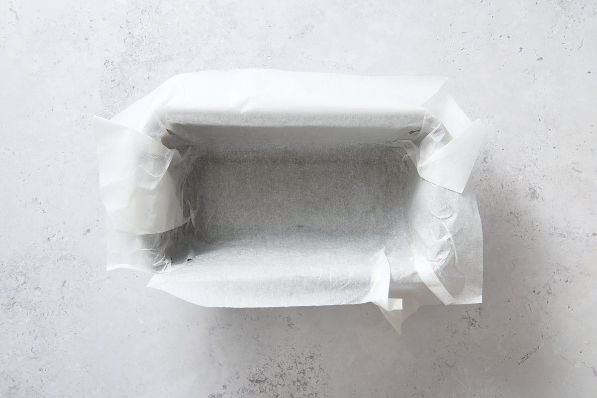 Loaf pan lined with parchment paper