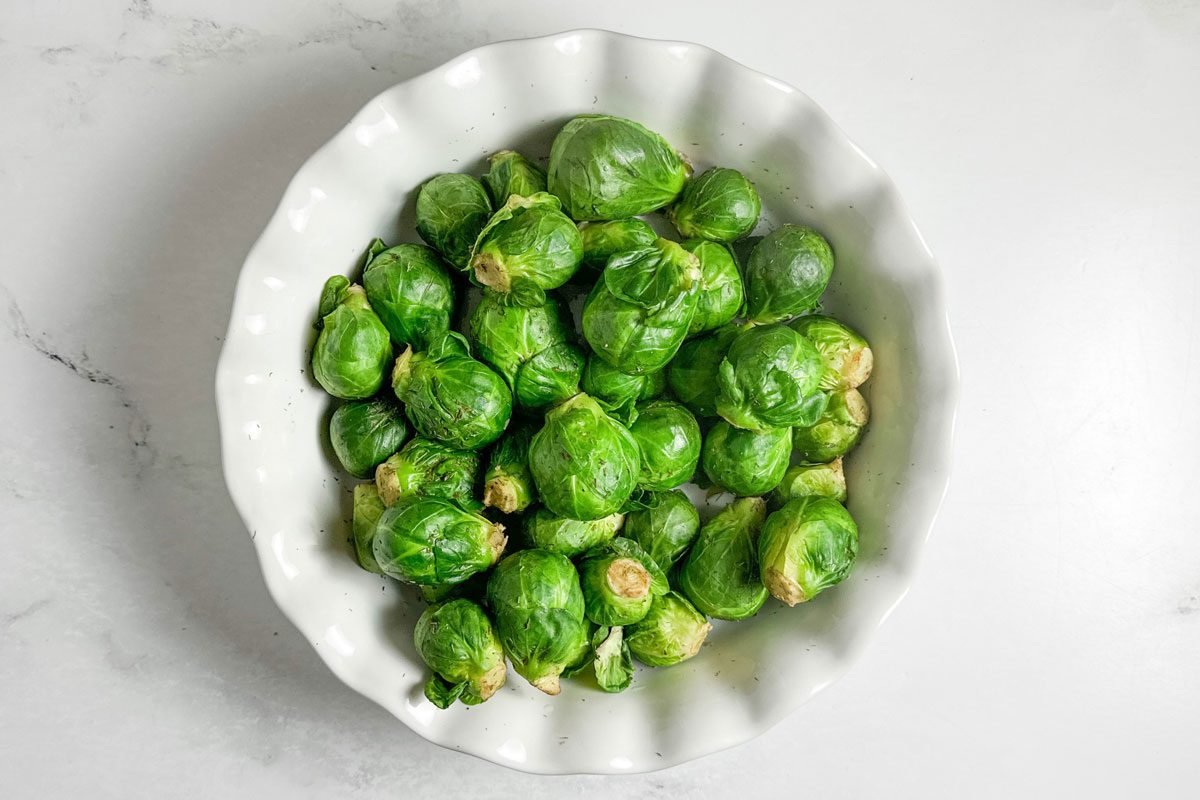 Taste of Home Microwave Brussels Sprouts in a white ceramic dish