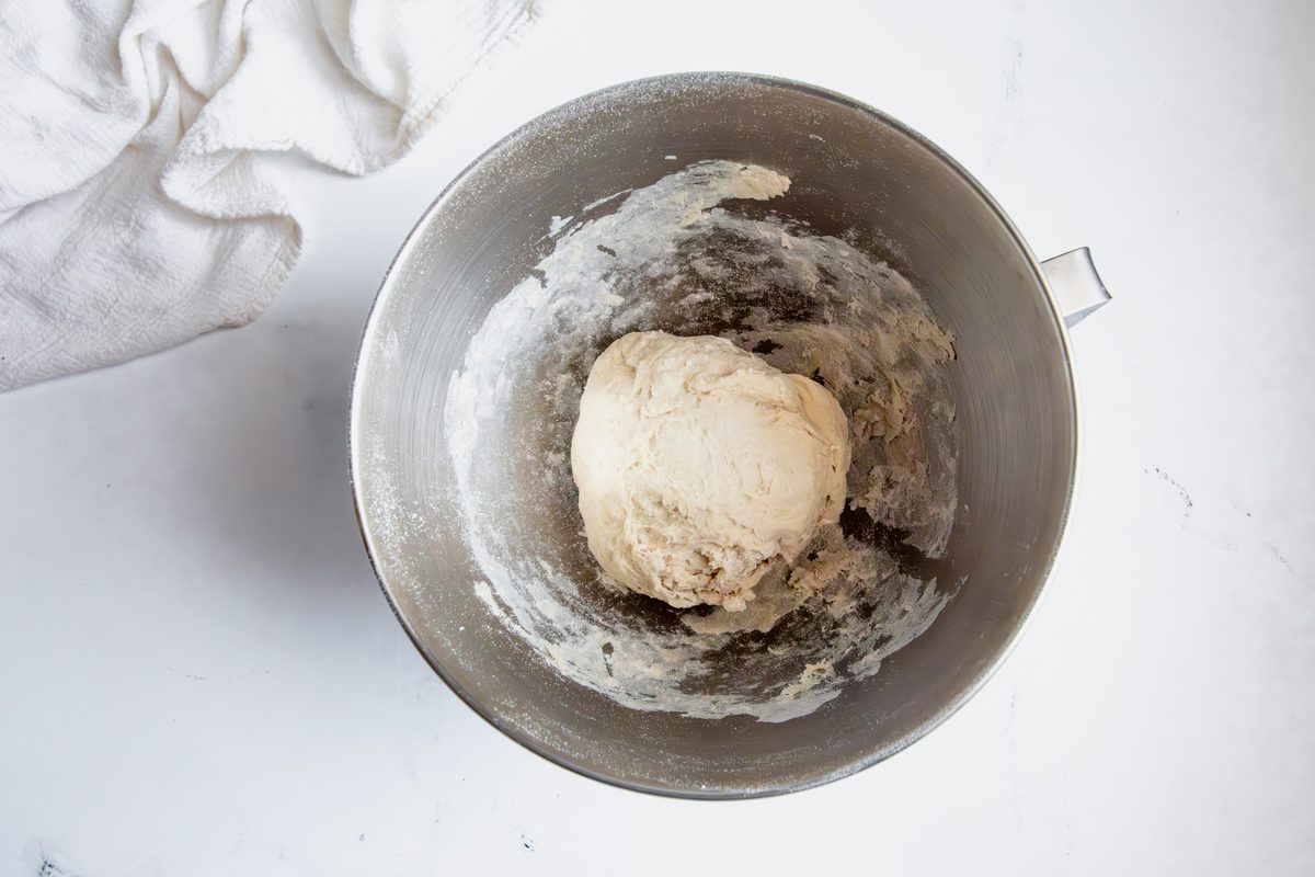 Oberhead shot for Taste of Home Mini Bread Loaf, bread kneaded and formed in a large mixing bowl.