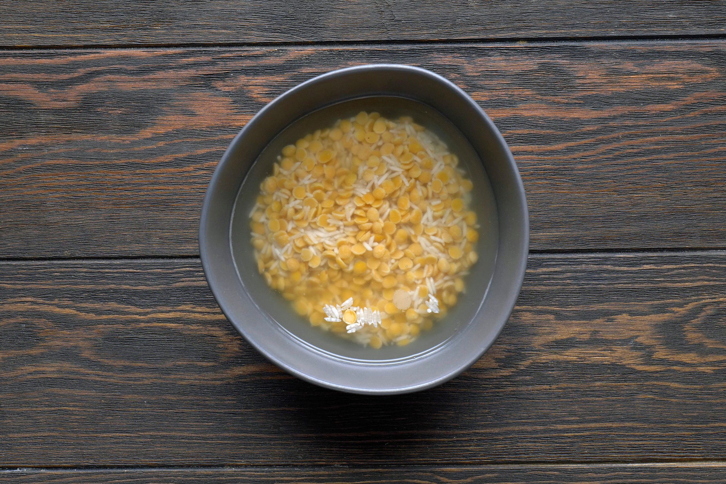 Soaked lentils and rice in a bowl
