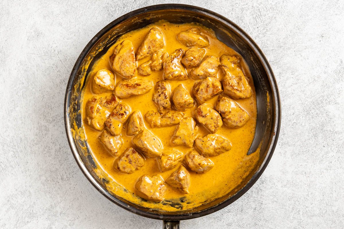 sauce and pork in a skillet