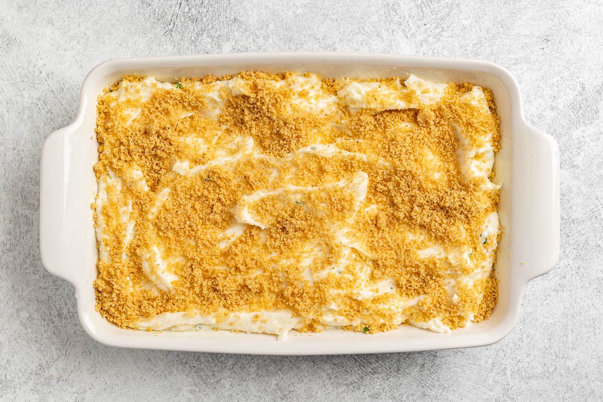 Taste of Home Party Mashed Potatoes photo of mixed and seasoned potatoes in a casserole dish.