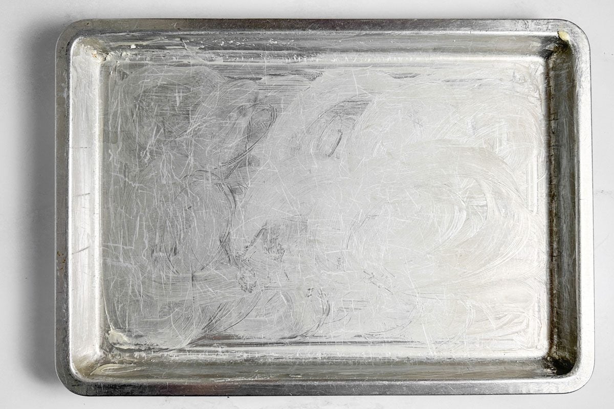 Greased baking sheet for Taste of Home Pecan Brittle