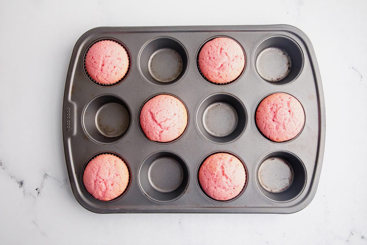Overhead shot for Taste of Home Pink Cupcakes, cupcakes baked in a cupcake tin.