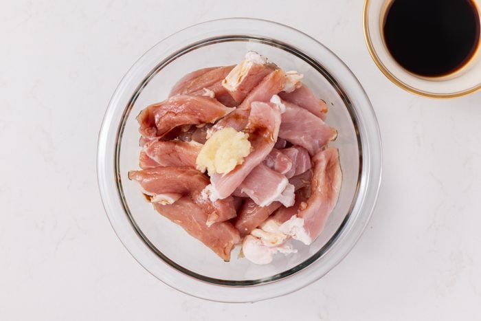 Small bowl with pork marinating.