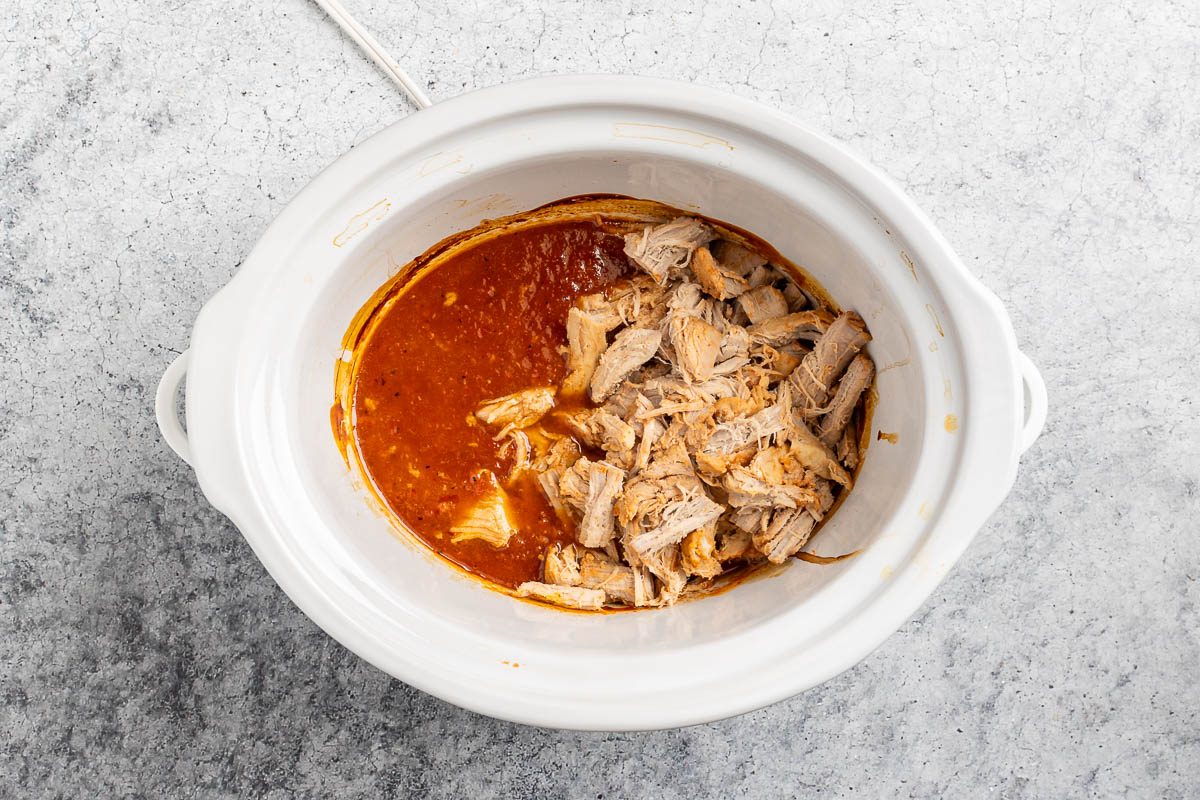 cooked and shredded pork back in the slow cooker.