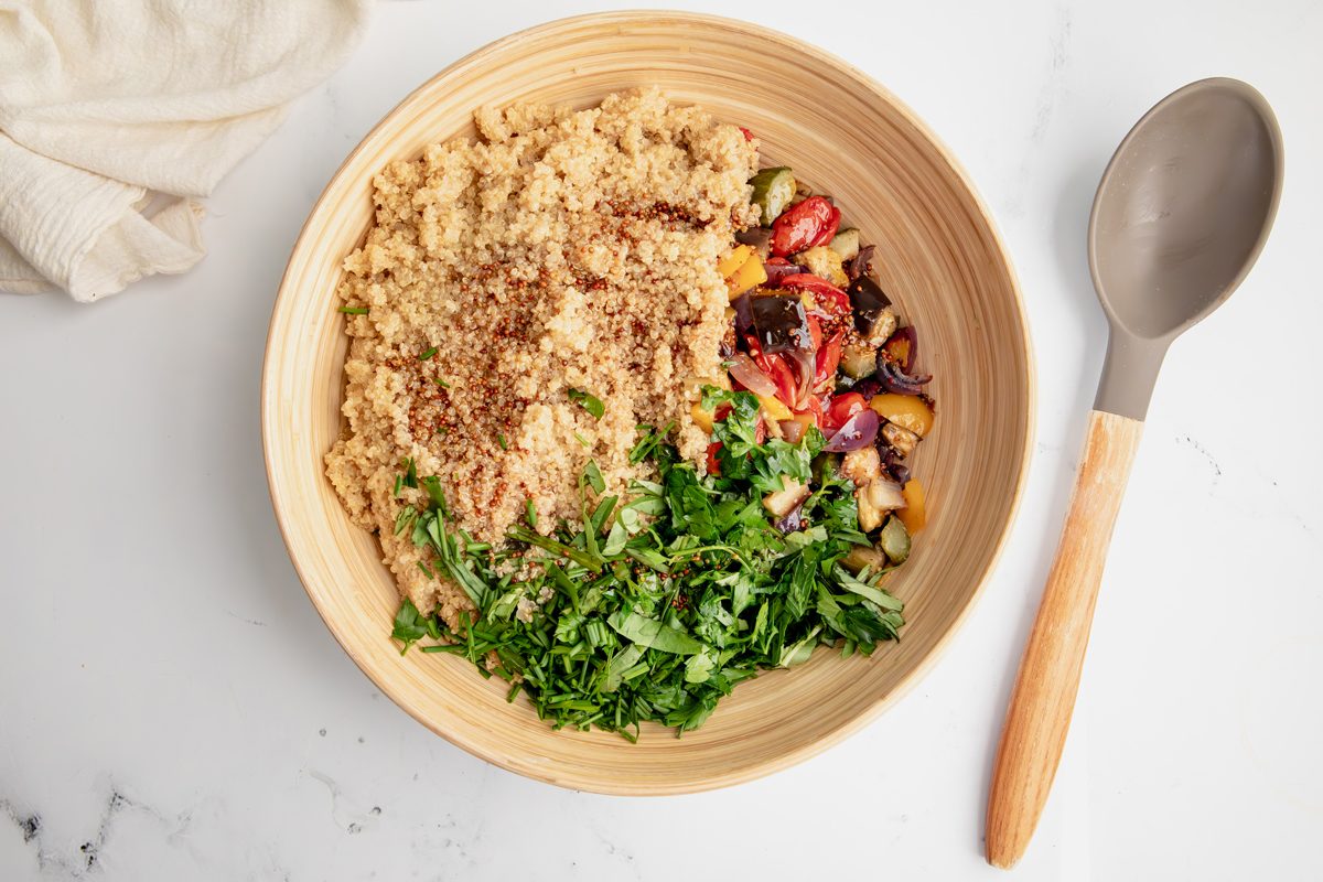 Overhead shot for Taste of Home Quinoa with Vegetables, ingredients in bowl before being mixed together.